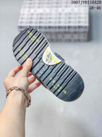 Underside view of a Premiata sneaker showing a black lugged outsole with printed lettering; image text shows 2607 TYD110A20 and 38–46.