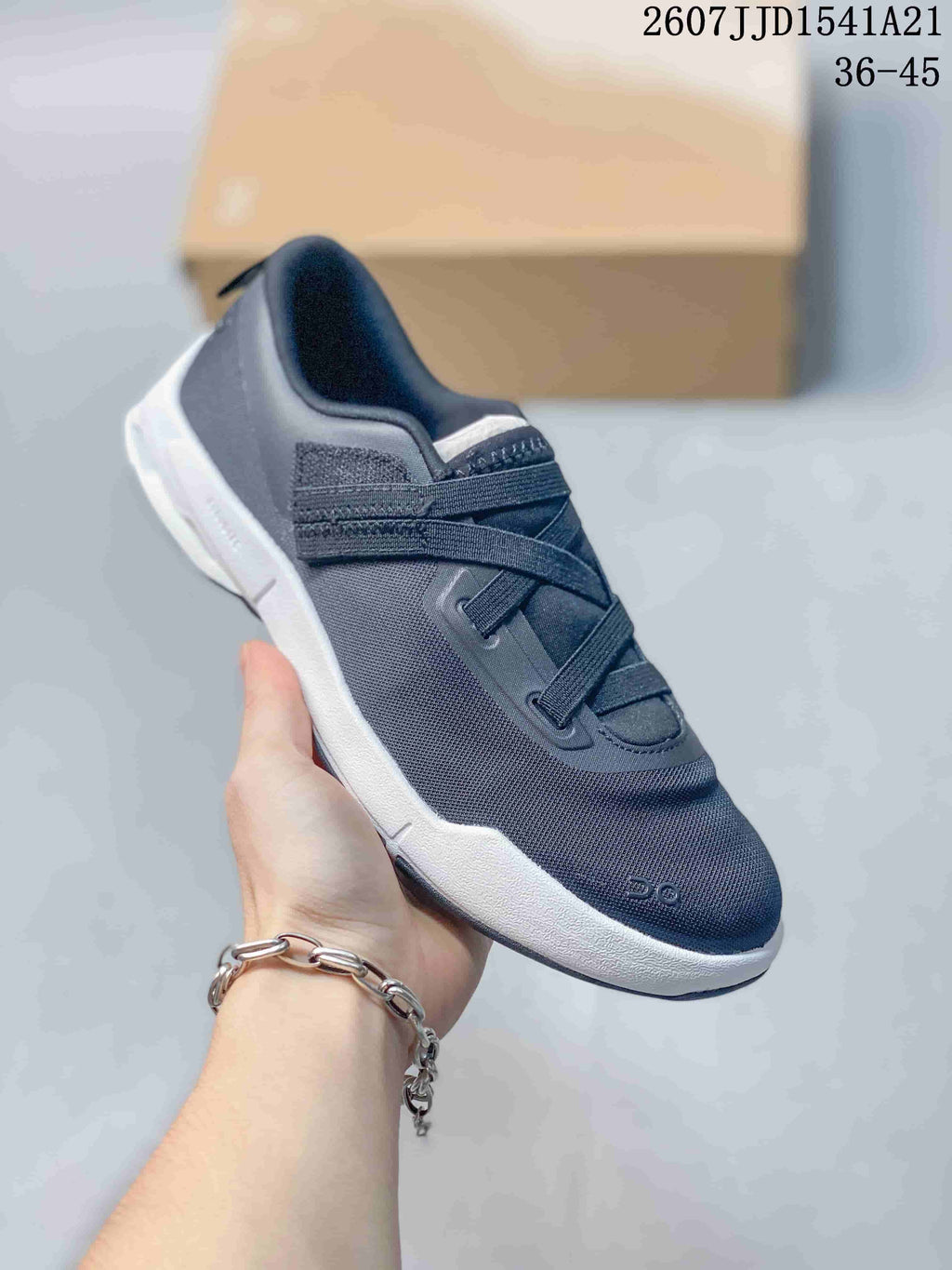 Angled side view of the dark navy sneaker with white midsole and low-profile athletic shape.