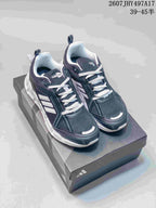 Pair of black and white Adidas Climacool running shoes shown on a shoebox from an elevated front angle.