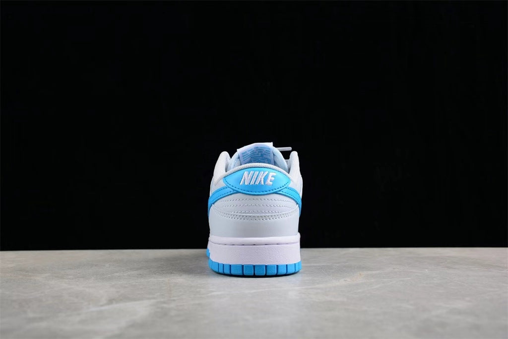 Rear view of the sneaker showing the blue heel detail, white heel panel, padded collar, and blue outsole.
