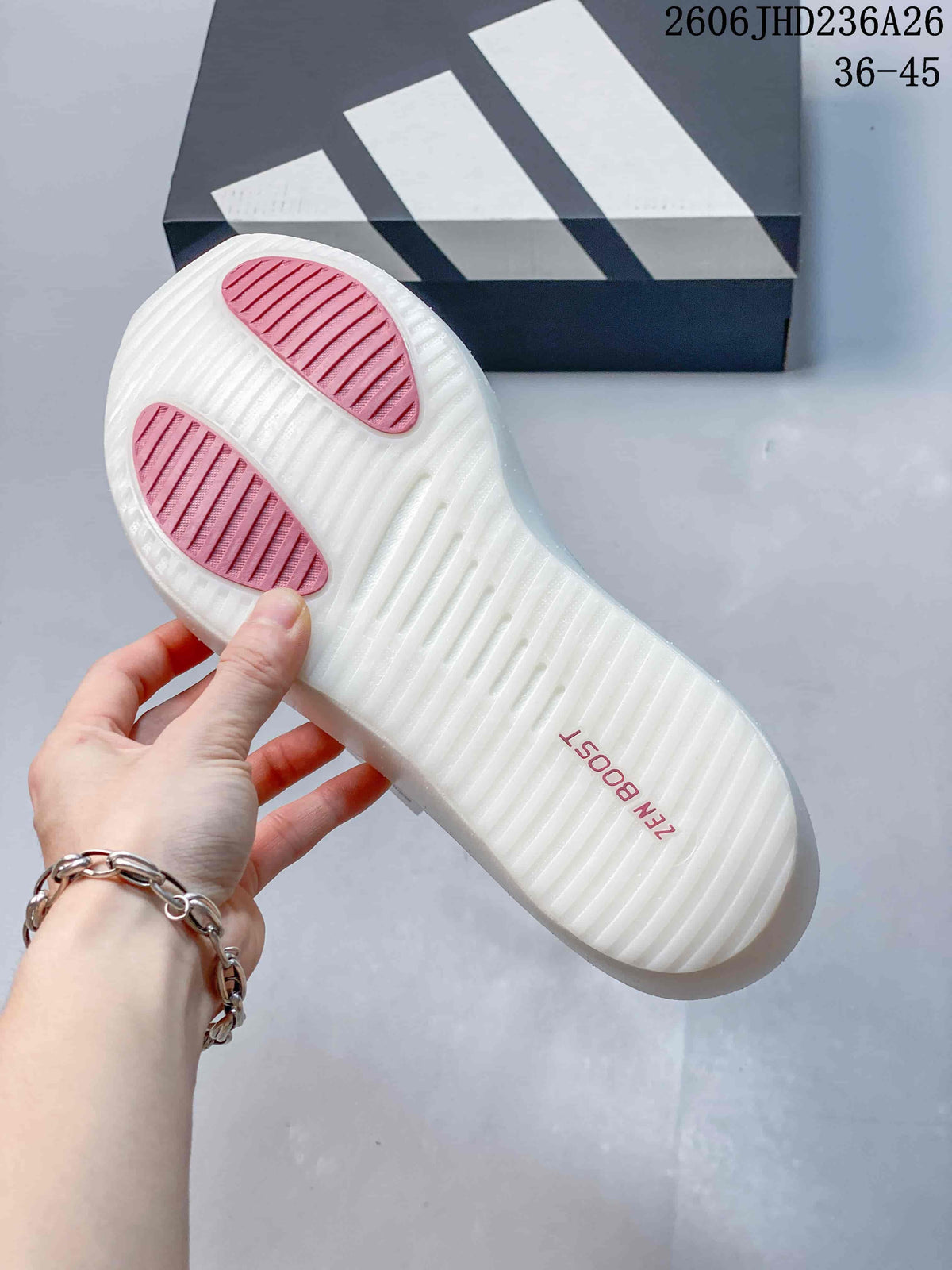 Underside of a white ZenBoost shoe sole with pink traction sections.