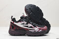 Pair of burgundy, black, and white Be Right Back sneakers shown from the side, with one shoe lifted to show the lugged outsole.