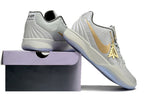 Gray and gold Ja 2 shoes displayed on and beside a shoe box.