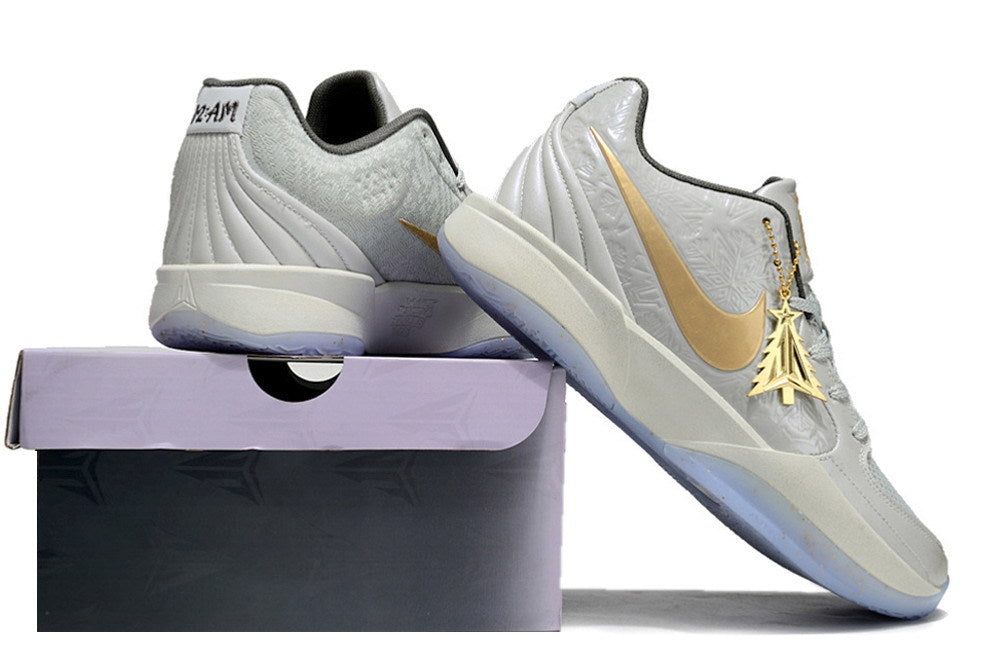 Gray and gold Ja 2 shoes displayed on and beside a shoe box.