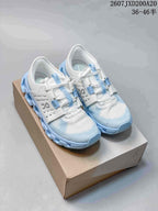 Pair of white and light blue On Cloudswift Amp sneakers displayed on a shoe box.