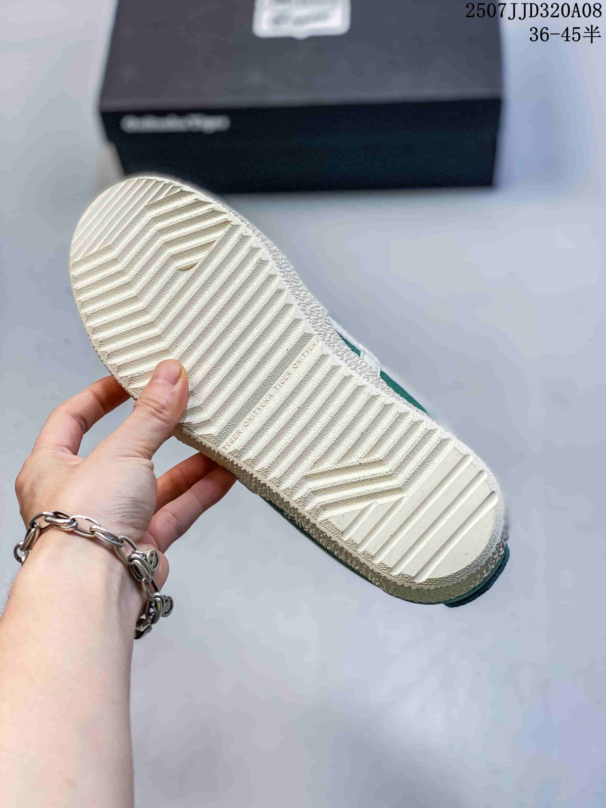 Close-up of the cream outsole showing its grooved tread pattern and textured edge.