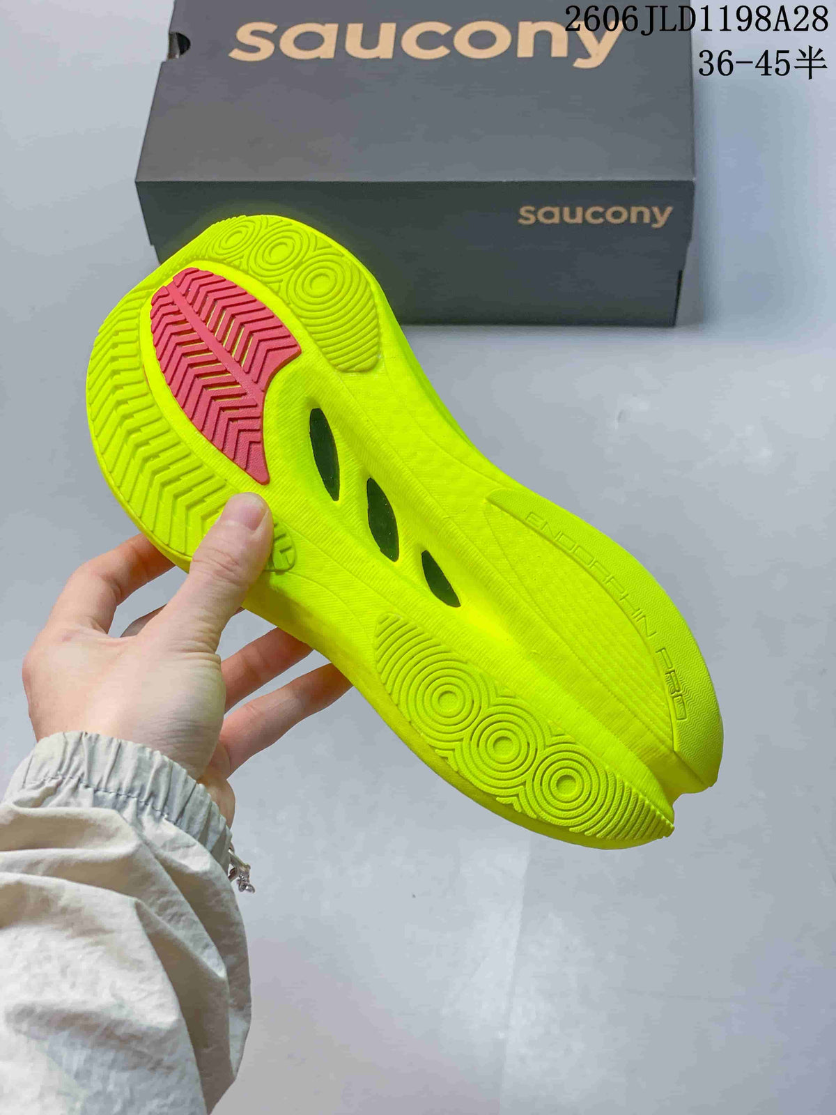 View of the bright volt-yellow outsole with patterned tread