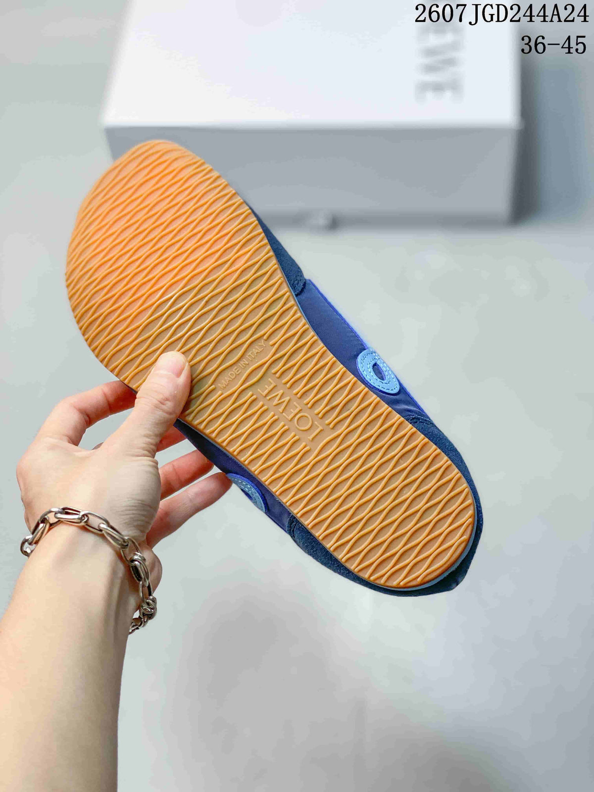 Underside of the sneaker showing a gum-colored outsole with a repeating textured tread pattern and Loewe branding.