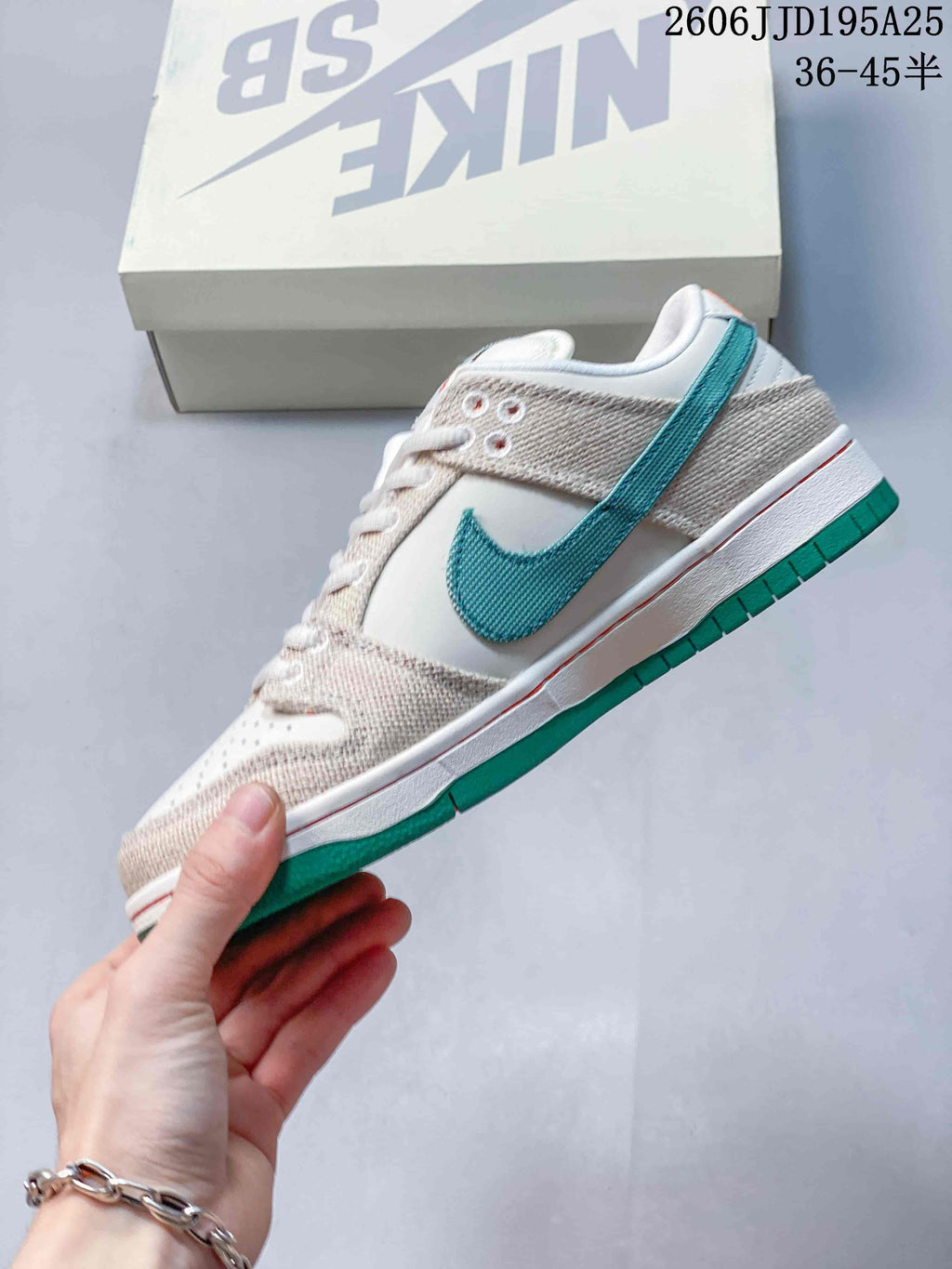 Side profile showing the white upper, woven-texture overlays, green Swoosh-style branding, white midsole, and green outsole.
