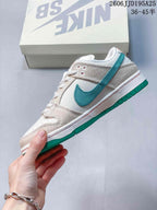 Side profile showing the white upper, woven-texture overlays, green Swoosh-style branding, white midsole, and green outsole.