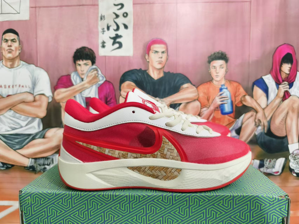 Side view of a white and red Anta KT 10 basketball shoe with patterned side panel