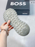 Close-up of the lugged outsole tread on a BOSS sneaker
