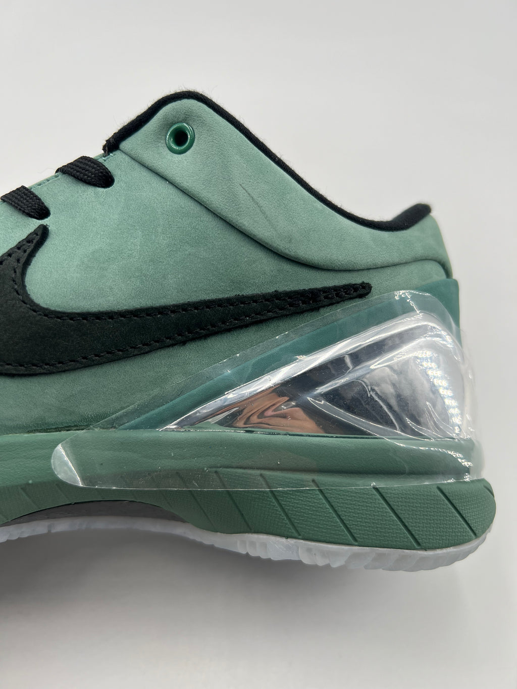 Close-up of the green heel, black Swoosh and clear heel accent