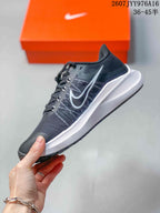 Side profile of the black and white Nike Zoom Winflo 8 sneaker with lace closure and contrasting branding.