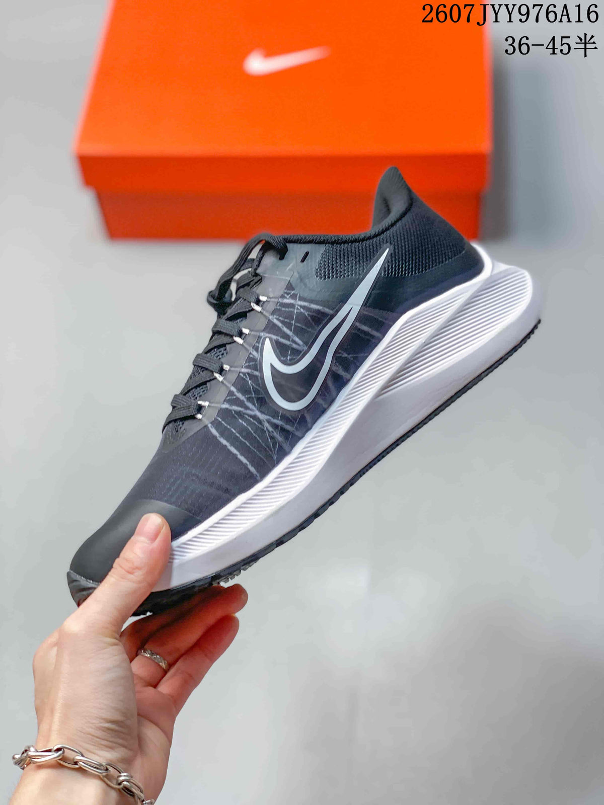 Side profile of the black and white Nike Zoom Winflo 8 sneaker with lace closure and contrasting branding.