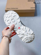 Close-up of the Salomon XT-6 outsole showing a white lugged tread pattern and visible Contagrip branding.
