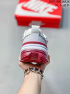 Rear view showing the padded heel, pull tab and red outsole sections.