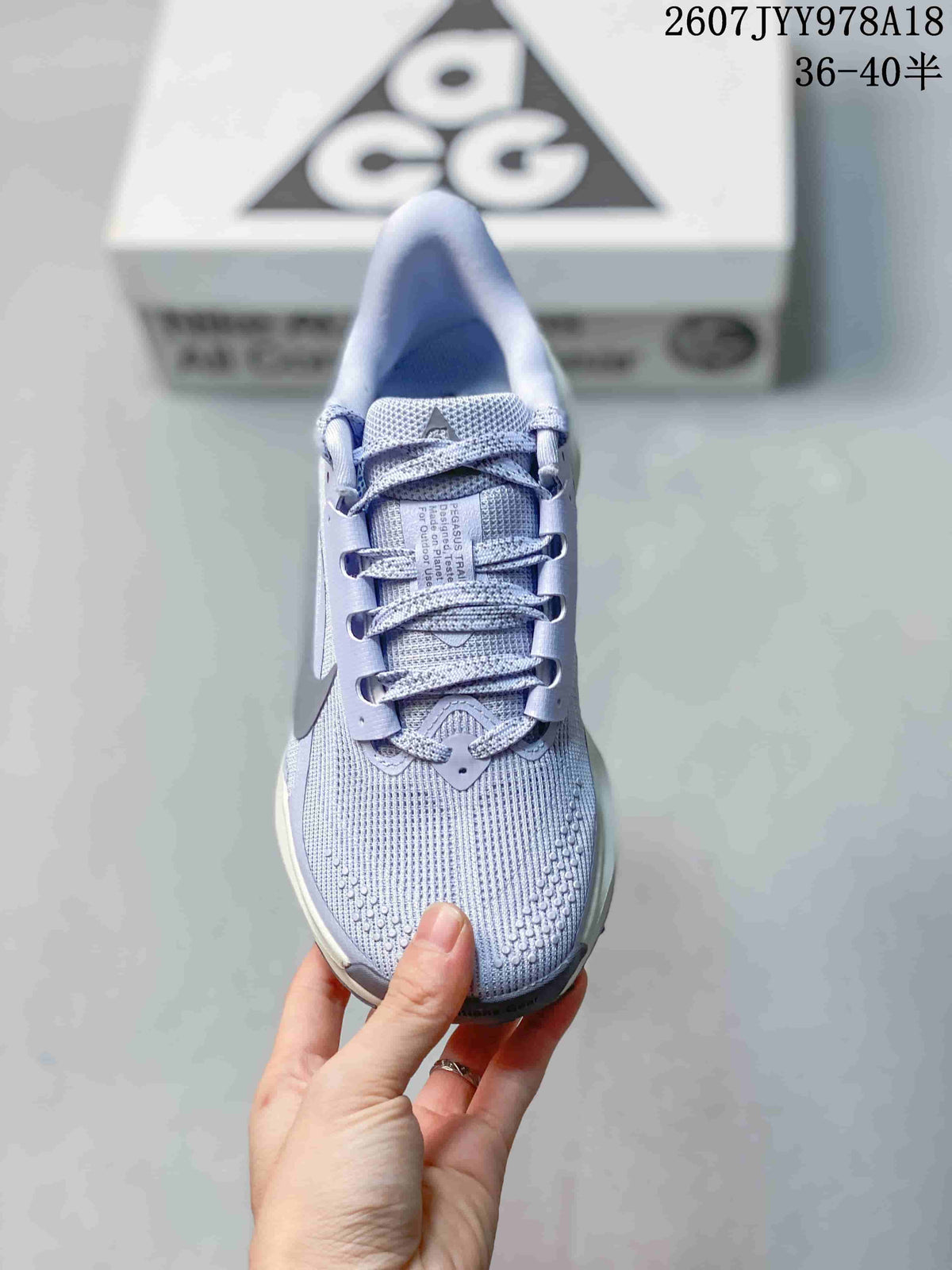 Top view of a lavender Nike ACG Pegasus Trail sneaker showing the lace-up closure, textured toe area, and tongue details.