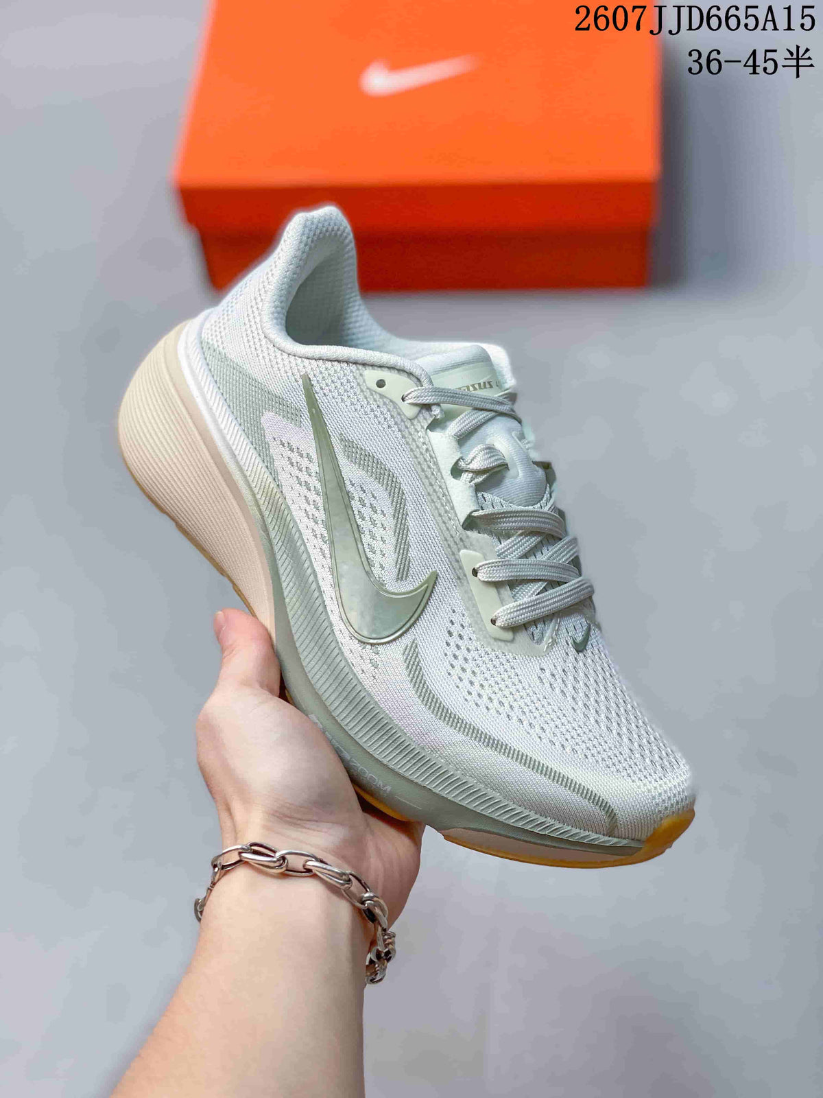 Angled side view of the Nike Pegasus 42 sneaker showing the green Swoosh, textured upper, sculpted midsole, and gum outsole accents.