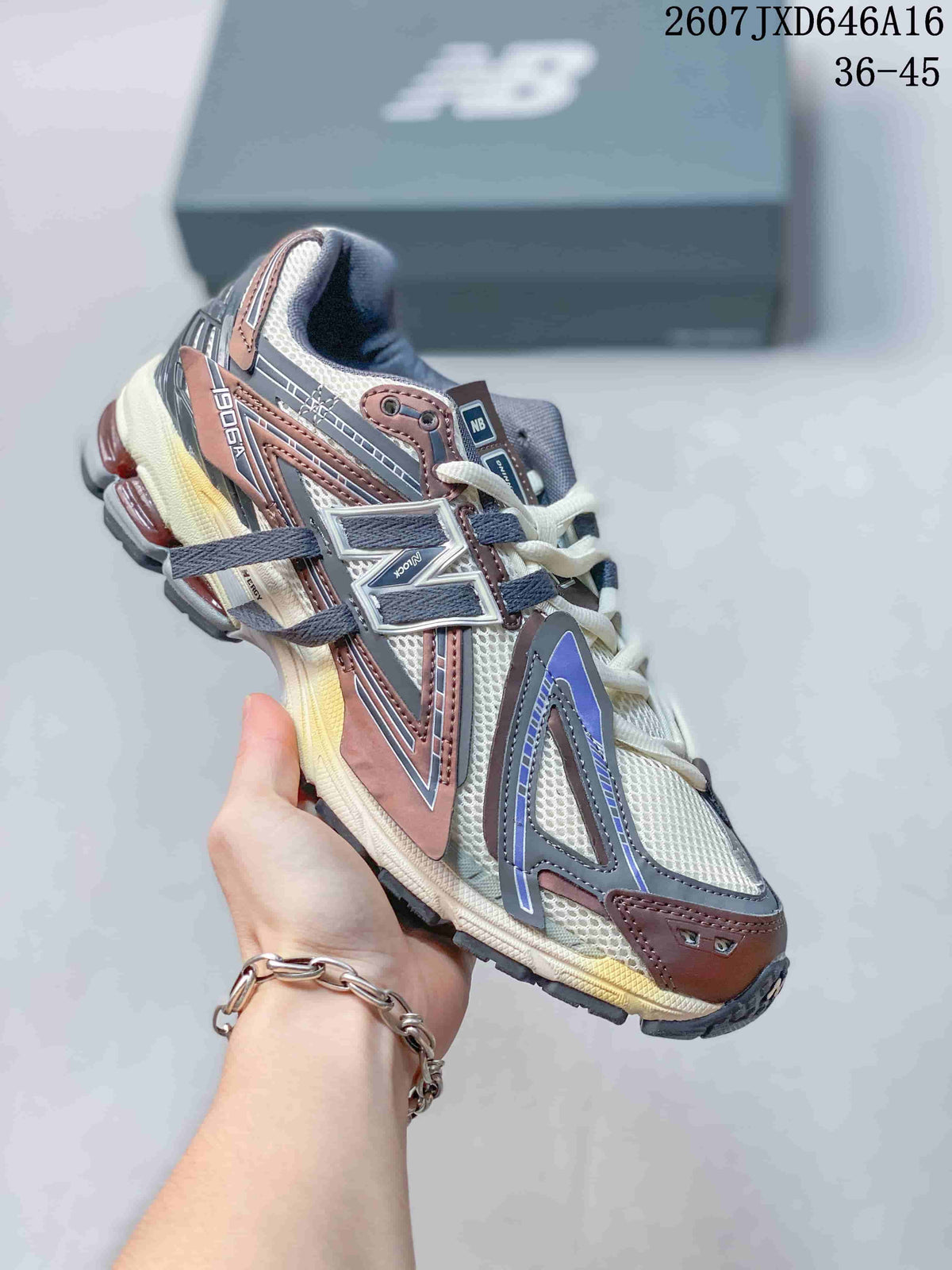 Angled side view of the New Balance 1906A sneaker showing the multicolor upper, side logo and heel cushioning details.