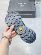 Close-up of the lugged outsole with a Vibram badge