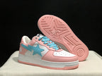 Angled view of the sneaker and its exposed pink outsole with geometric tread and a central star motif.