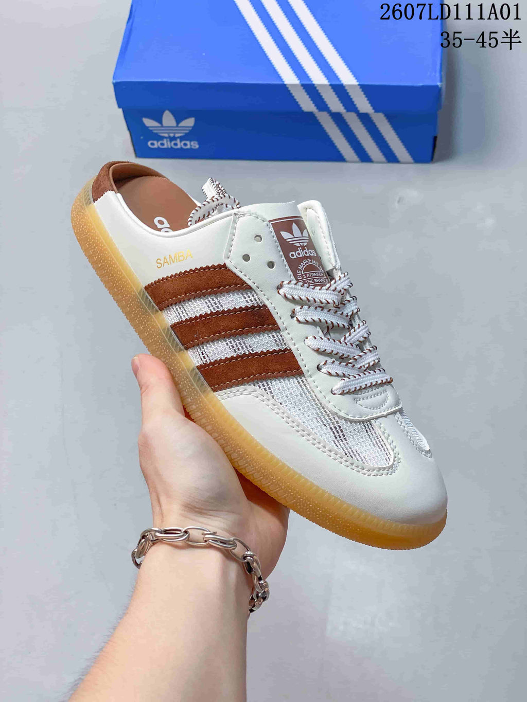 Angled view of the white and brown Samba OG Mule sneaker