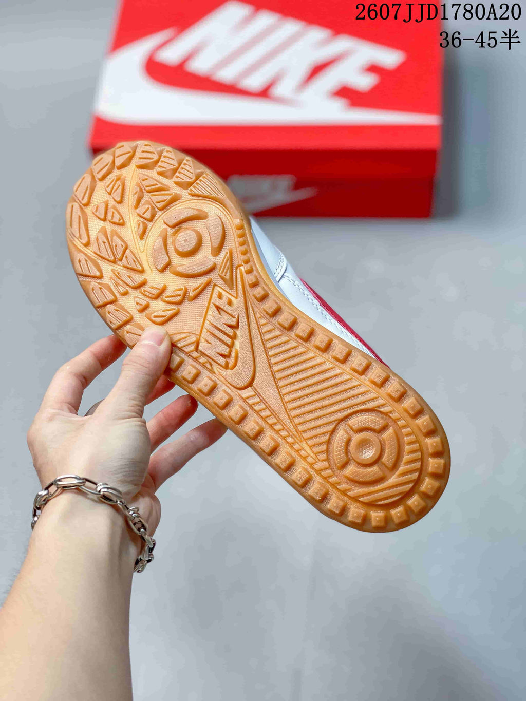 Close-up of the gum-colored outsole with raised geometric traction patterns.
