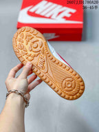 Close-up of the gum-colored outsole with raised geometric traction patterns.