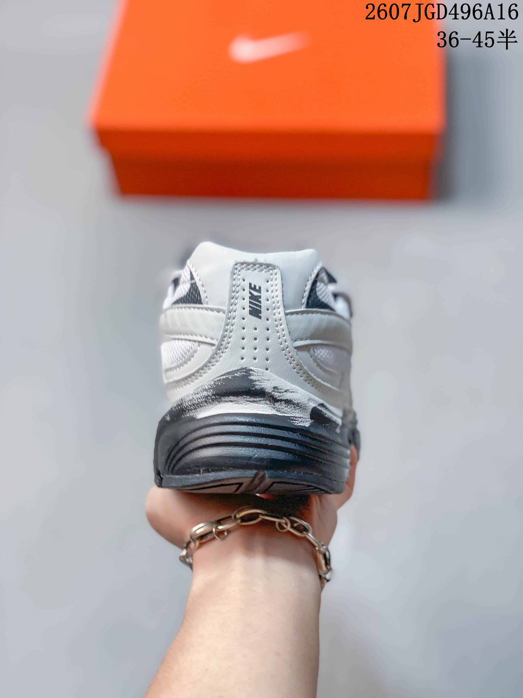 Rear view showing the padded heel, Nike branding and layered sole of the sneaker.