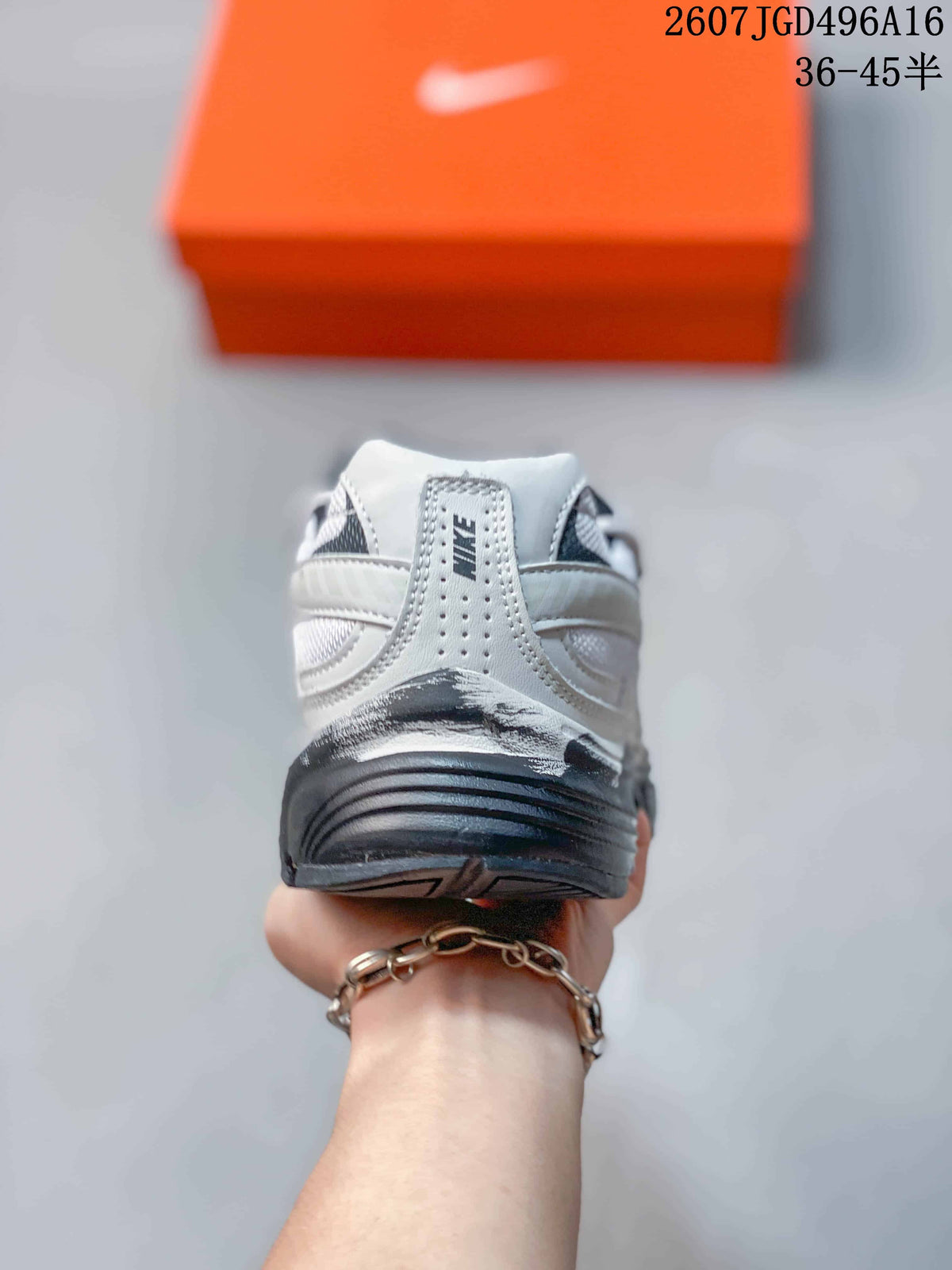 Rear view showing the padded heel, Nike branding and layered sole of the sneaker.