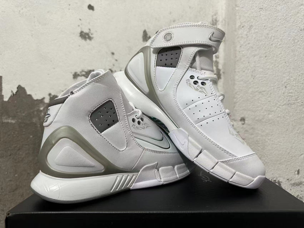 Angled view of white Nike Zoom Kobe 2K5 FTB high-top basketball shoes with ankle straps.