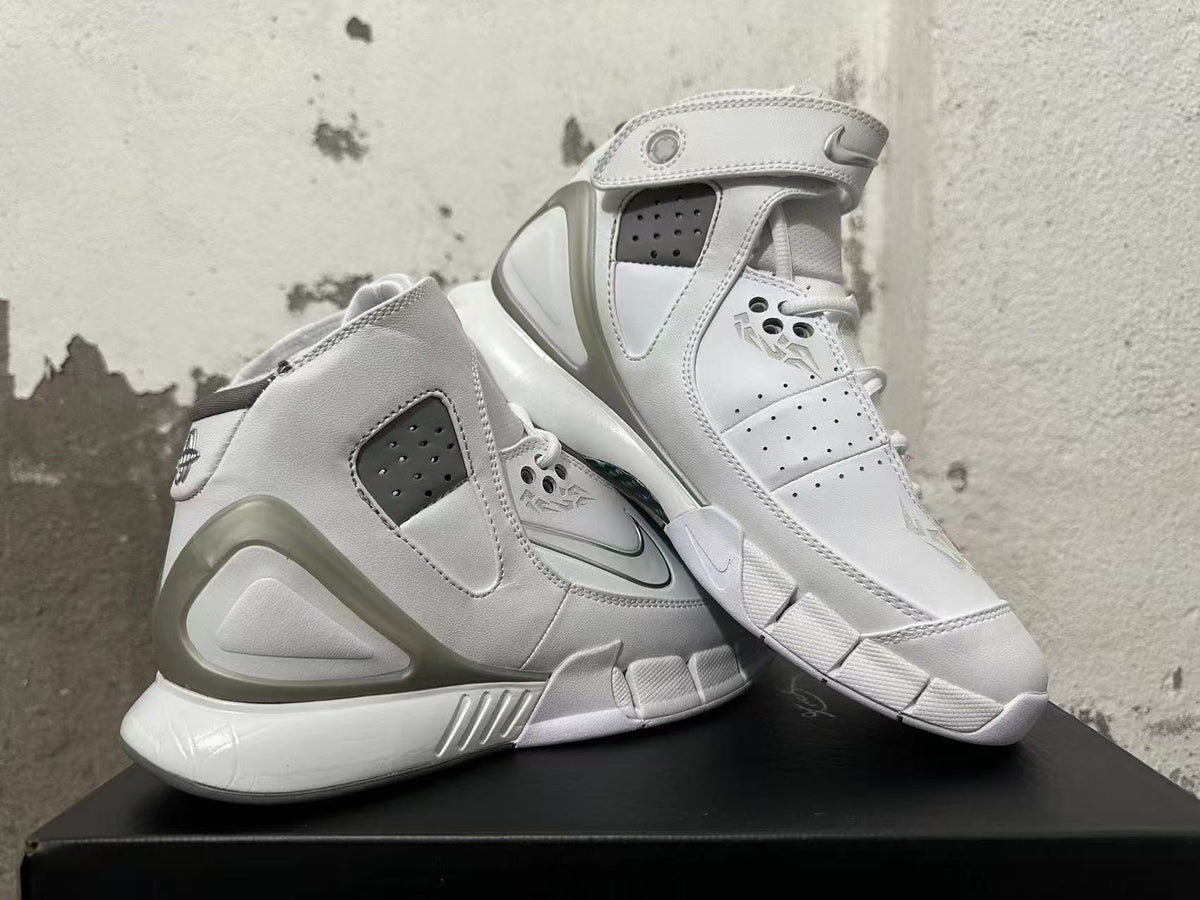 Angled view of white Nike Zoom Kobe 2K5 FTB high-top basketball shoes with ankle straps.