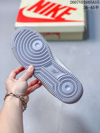 Close-up of the textured grey rubber outsole showing circular traction grooves and a Nike Air mark.