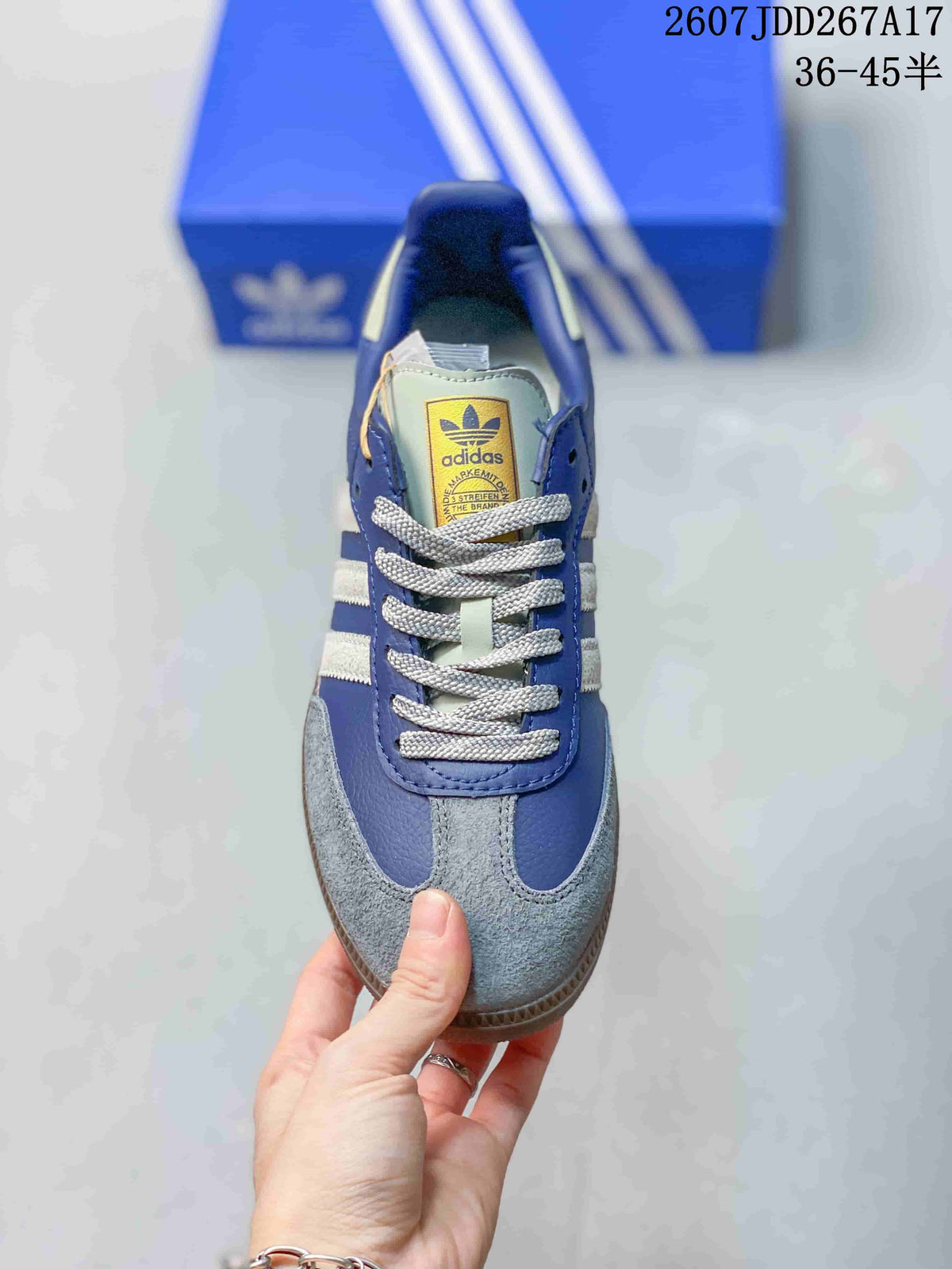 Top view showing the gray laces, white tongue label, blue upper, and gray textured toe panel.