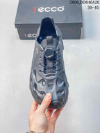 Top view of a gray clog showing its ventilation openings and lace-up closure.