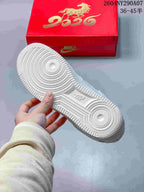 White sneaker outsole showing the circular traction pattern and textured rubber tread.