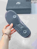 Outsole view of a grey Nike Air Force 1 sneaker