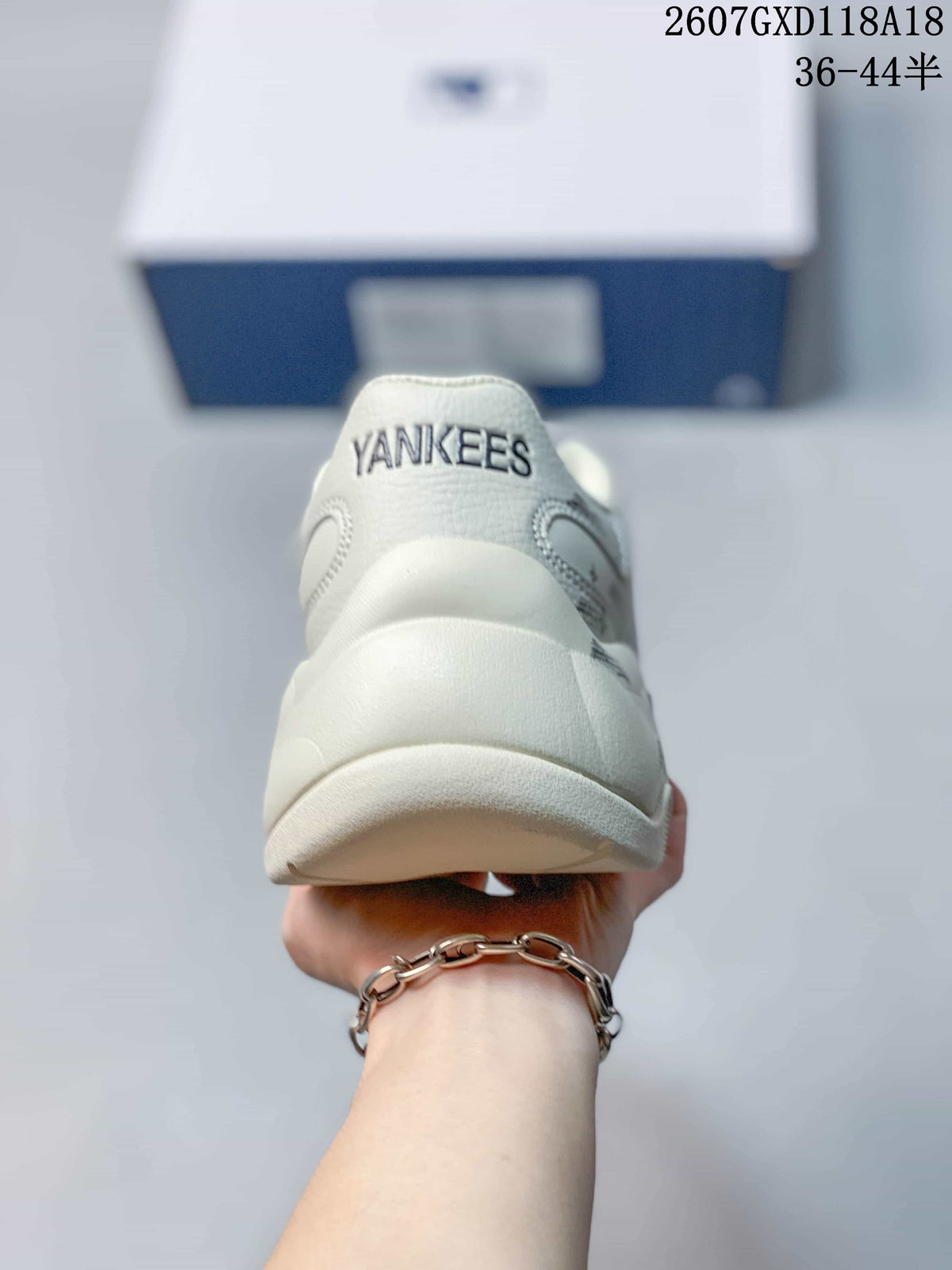 Rear view of the sneaker showing the raised heel structure and Yankees lettering.