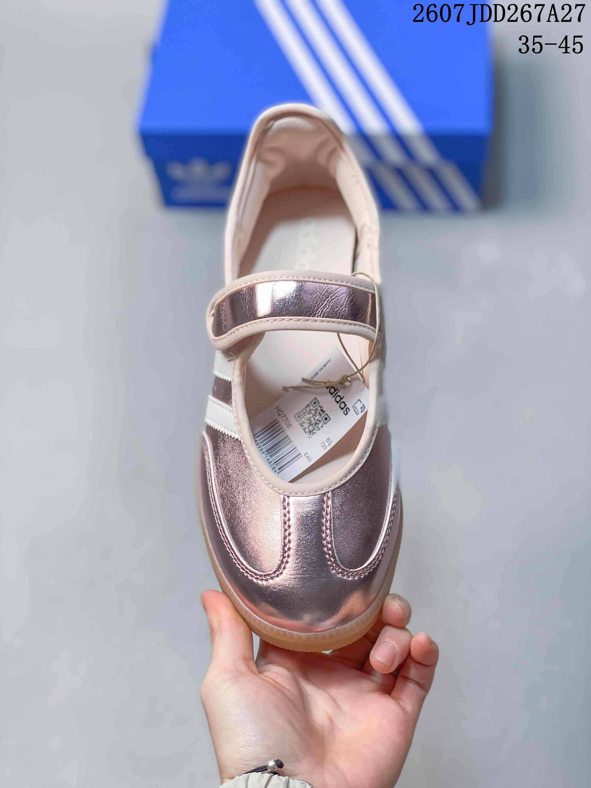 Top view showing the rounded toe, metallic pink finish, white lining and wide strap across the upper.