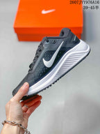 Side profile showing the white Nike Swoosh, mesh-textile upper, white midsole, and black outsole.