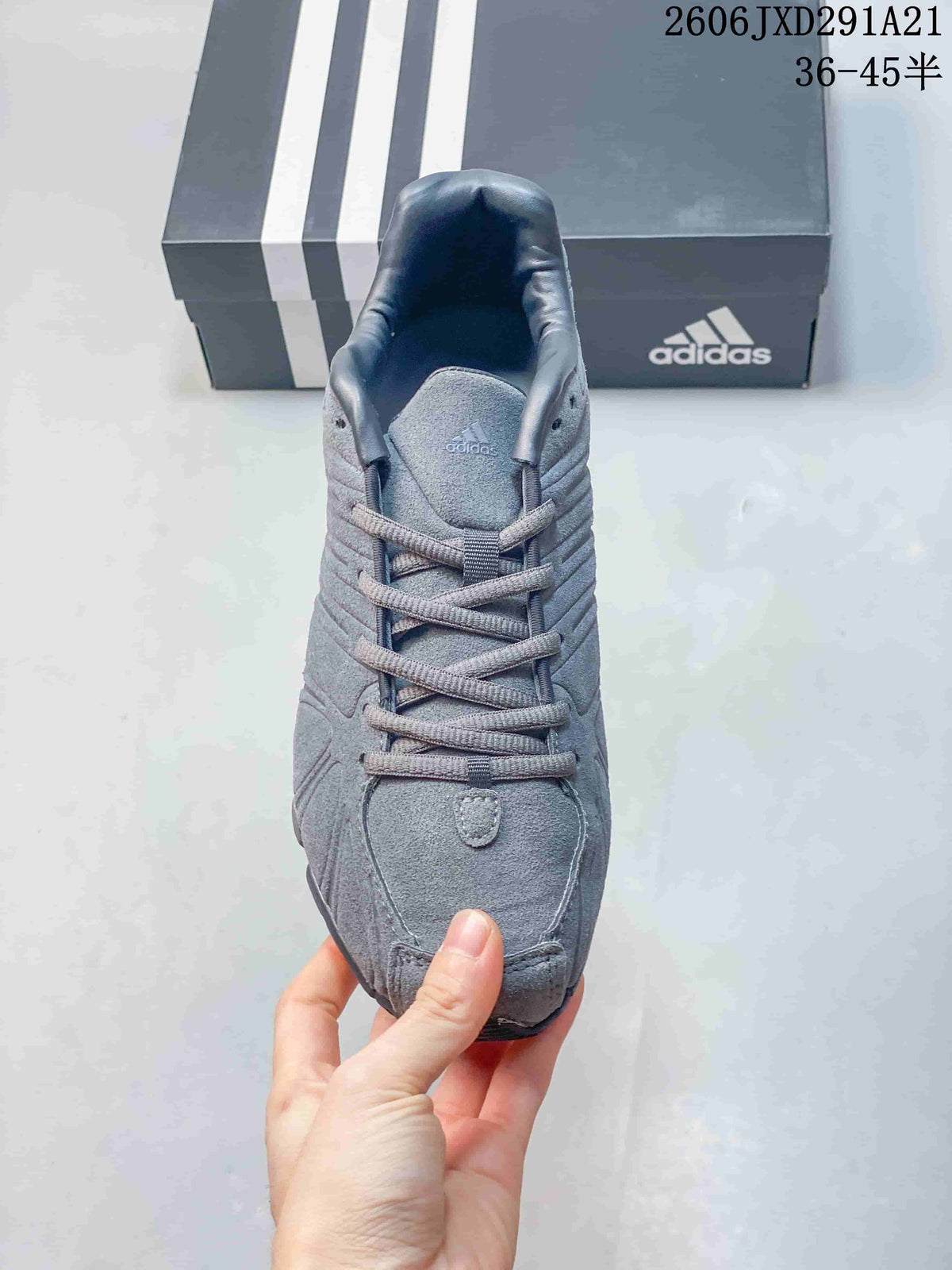 Top view of the gray sneaker showing the lace-up construction, tongue, and textured toe panel.