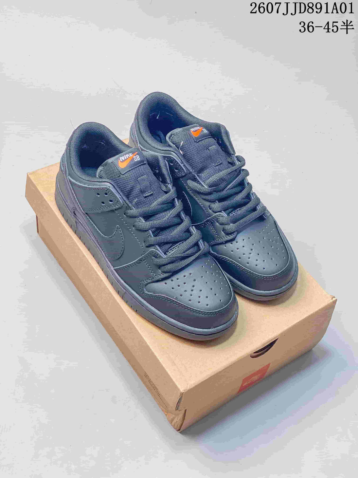 Pair of dark gray Nike Dunk Low sneakers shown from above