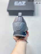 Rear view of the gray sneaker showing the EA7-marked heel counter and pull tab.