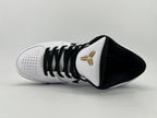Top-down view showing the laces, tongue emblem, and black lining