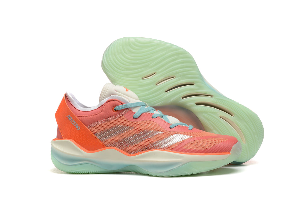 Adizero sneaker in coral red and orange with metallic-looking stripes and a pale green sole