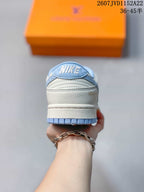 Rear view showing the padded collar, tongue branding and layered heel construction.