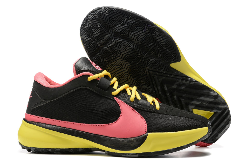 Black basketball shoes with a pink Swoosh, yellow laces, and bright yellow accents.