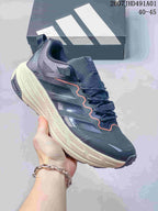 Dark gray Adidas Terrex low-top shoe with a light sole and orange detailing; image displays the size range 40–45.