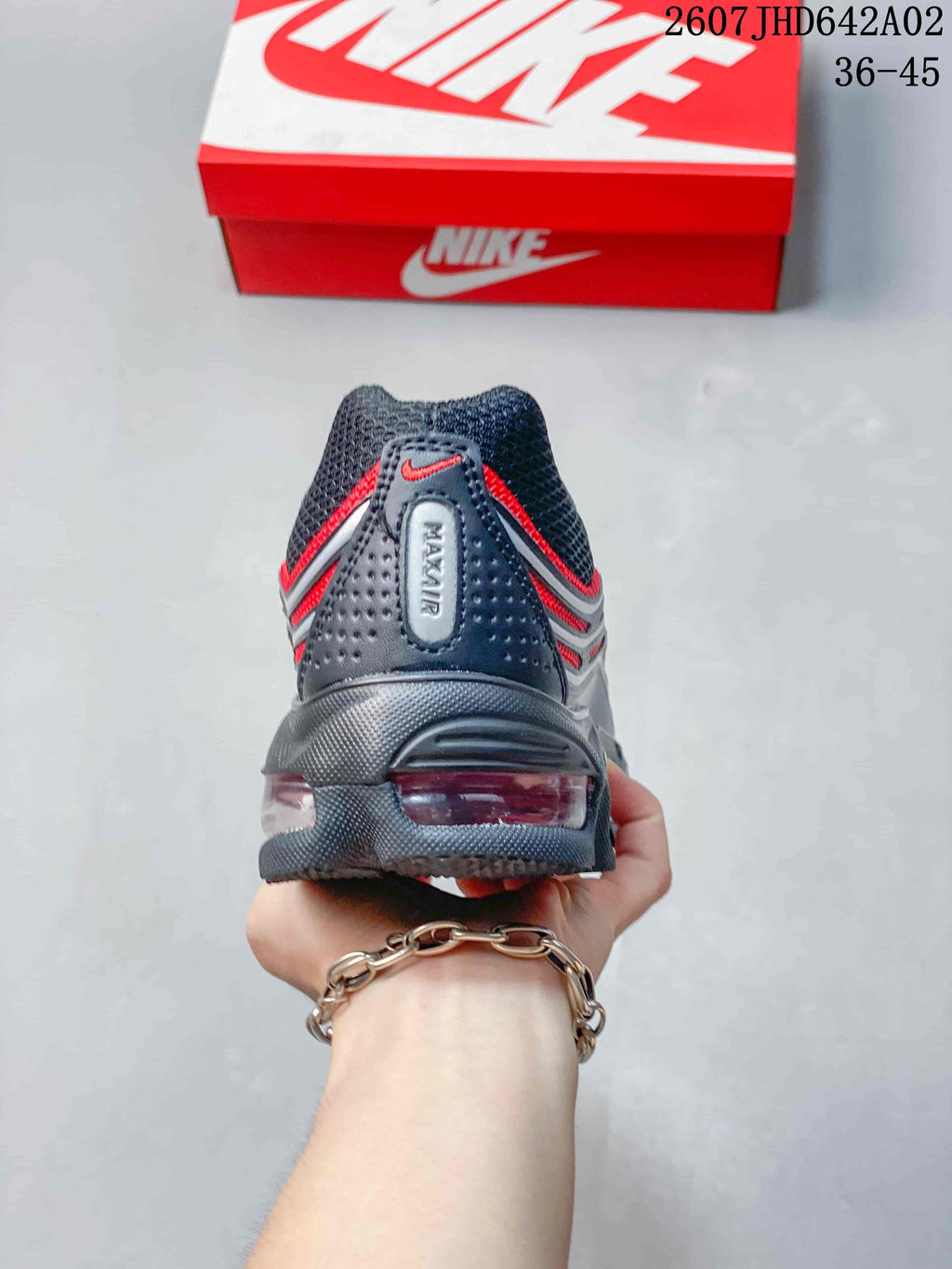Rear view of the sneaker showing its heel air unit and red detailing.